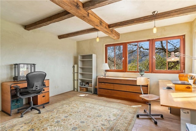 home office with beamed ceiling and light wood-type flooring