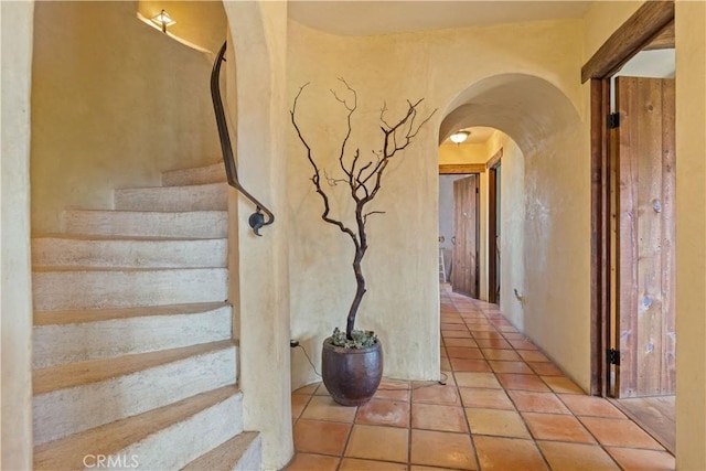 stairs with tile patterned floors