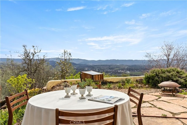 view of patio / terrace featuring a mountain view