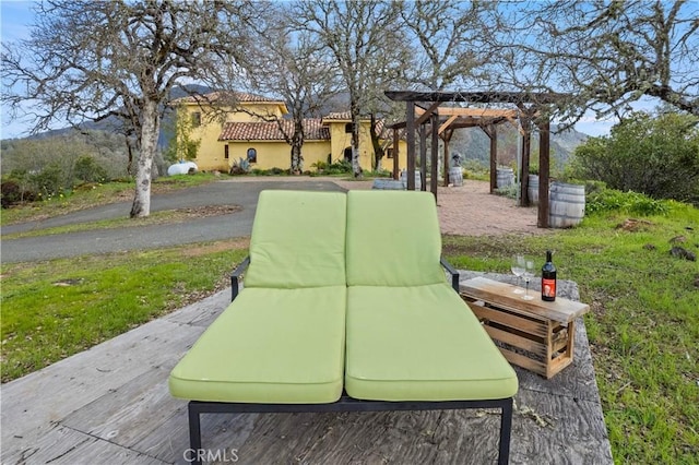 surrounding community featuring a yard and a pergola