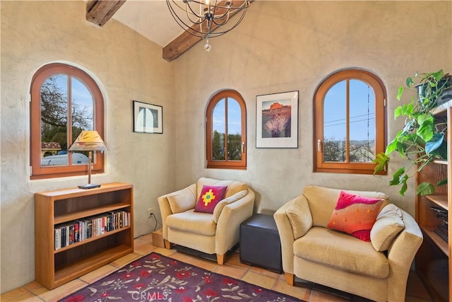 sitting room featuring light tile patterned floors, vaulted ceiling with beams, and a notable chandelier