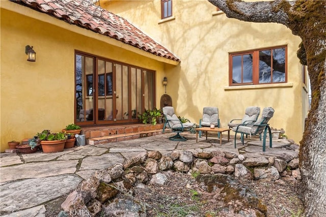 rear view of property featuring a patio