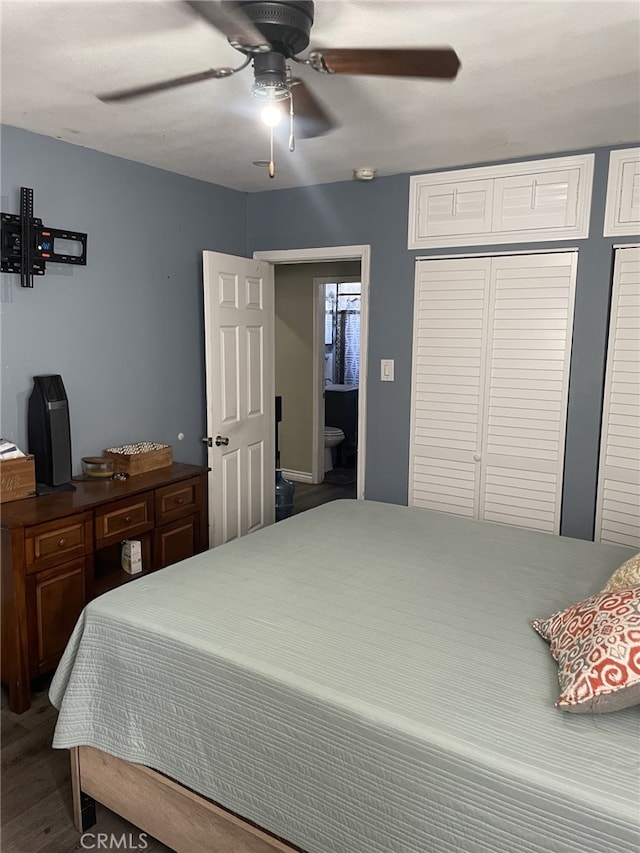 bedroom with ceiling fan, wood-type flooring, and ensuite bathroom