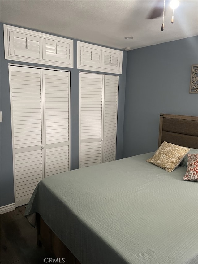 bedroom with ceiling fan and hardwood / wood-style floors