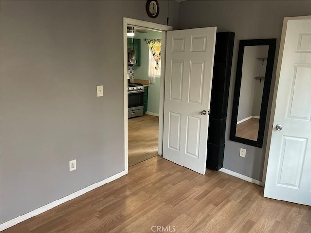 unfurnished bedroom featuring light wood-type flooring