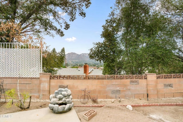 view of patio / terrace featuring a mountain view