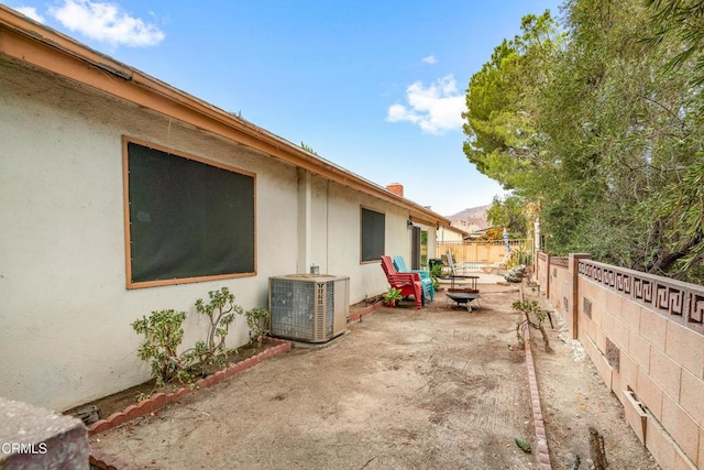 view of home's exterior with a patio and central AC