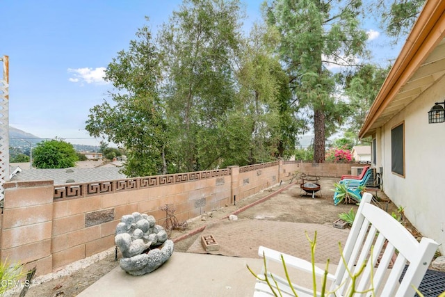 view of patio / terrace featuring a fire pit