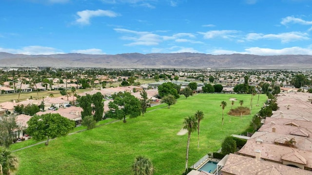 birds eye view of property with a mountain view