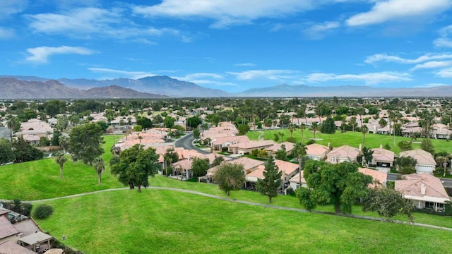 birds eye view of property featuring a mountain view