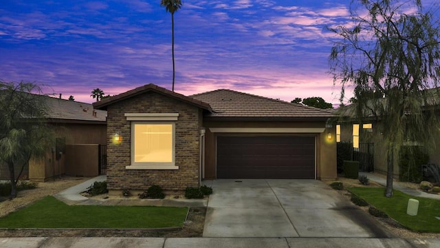 ranch-style home featuring a garage