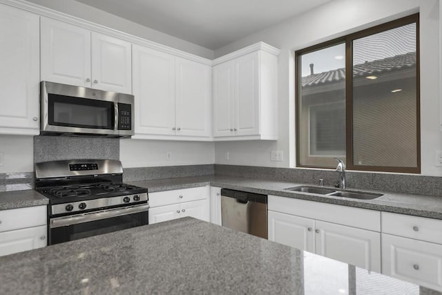 kitchen with white cabinetry, sink, and appliances with stainless steel finishes