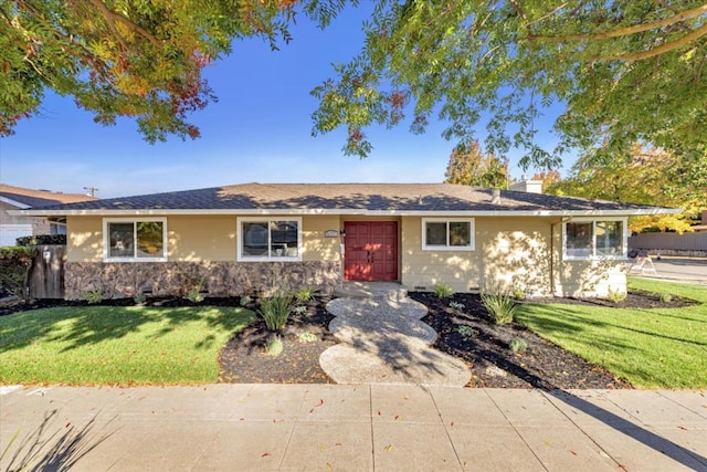 single story home featuring a front lawn