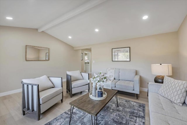 living room with vaulted ceiling with beams and light hardwood / wood-style flooring