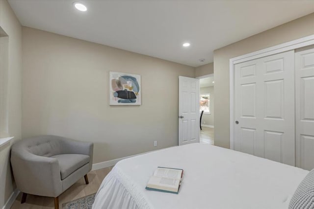 bedroom with a closet and light wood-type flooring