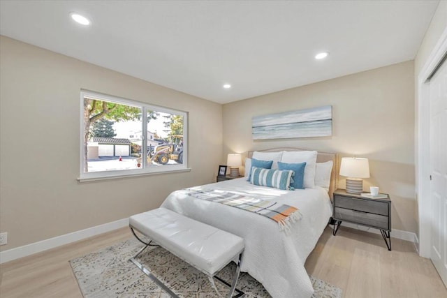 bedroom with a closet and light wood-type flooring