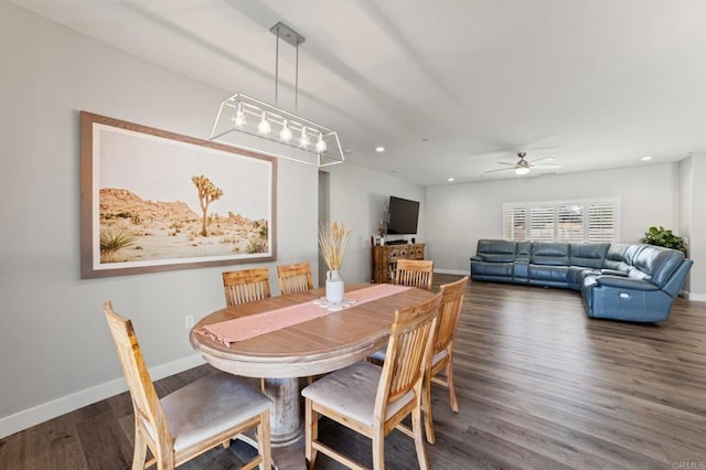 dining space featuring dark hardwood / wood-style floors and ceiling fan