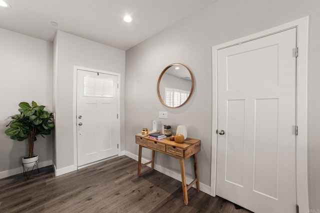 entryway with dark hardwood / wood-style floors