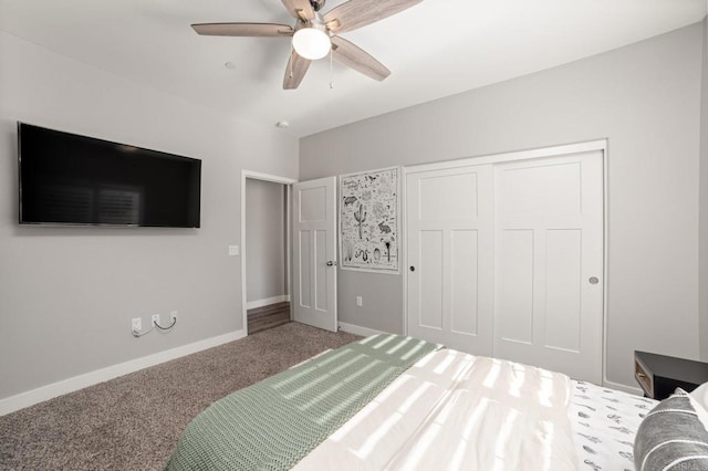 carpeted bedroom with ceiling fan and a closet