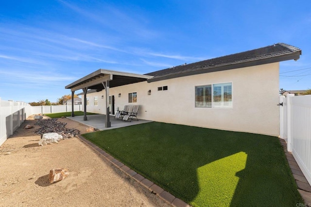 back of house featuring a patio