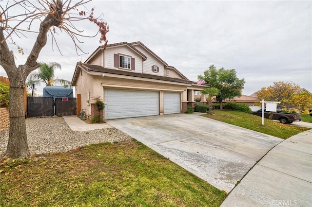 view of front of home featuring a garage and a front yard