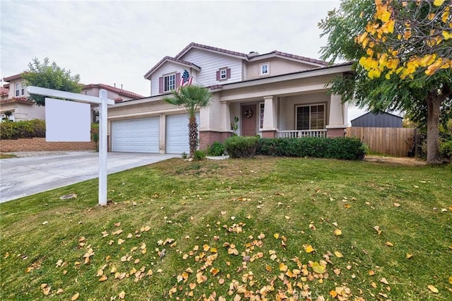 view of front of home featuring a front yard, a garage, and a porch