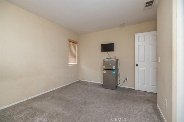 unfurnished bedroom featuring light carpet