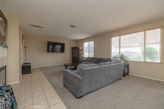 living room featuring light tile patterned floors and plenty of natural light