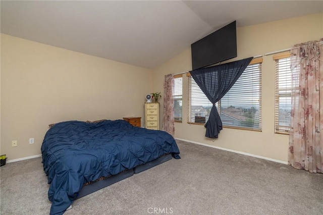 bedroom featuring carpet flooring and vaulted ceiling