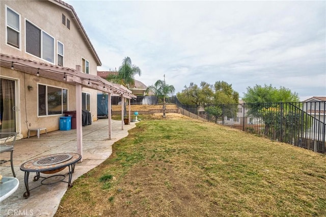 view of yard featuring an outdoor fire pit and a patio