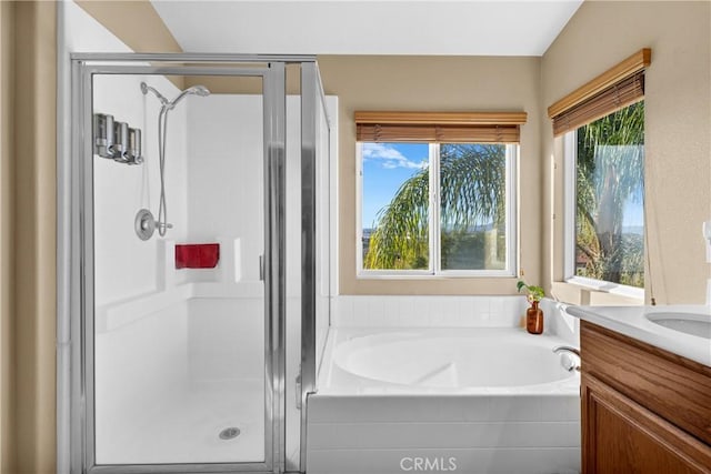 bathroom with plus walk in shower and vanity