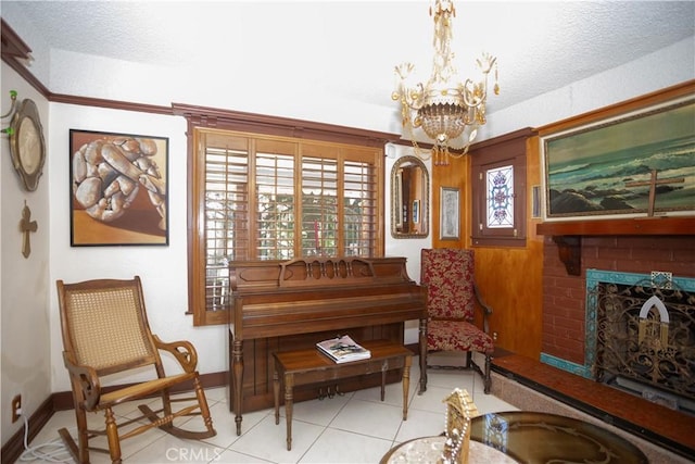 living area with a fireplace, light tile patterned floors, a textured ceiling, and an inviting chandelier