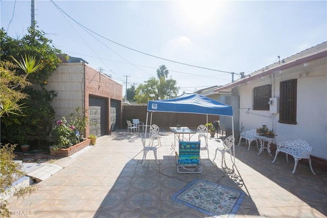 view of patio / terrace featuring a garage