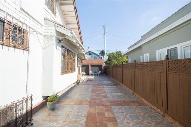 view of property exterior with a patio