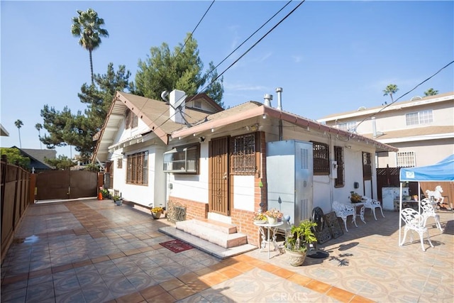 rear view of property featuring a patio area