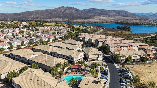 drone / aerial view with a water and mountain view