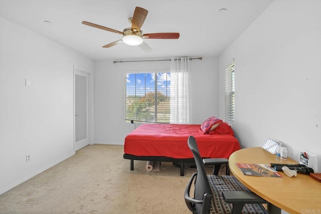 bedroom featuring ceiling fan and light colored carpet