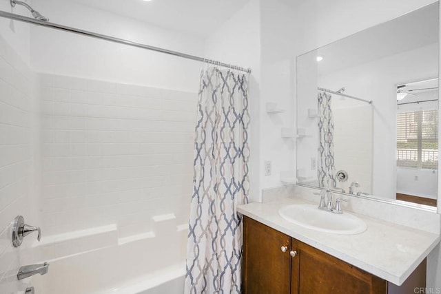 bathroom with vanity, ceiling fan, and shower / bathtub combination with curtain