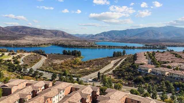 birds eye view of property featuring a water and mountain view