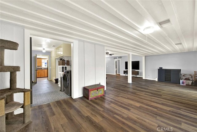 1938 Colusa, Corning, CA 96021 - unfurnished living room featuring dark wood-type flooring and washer / dryer