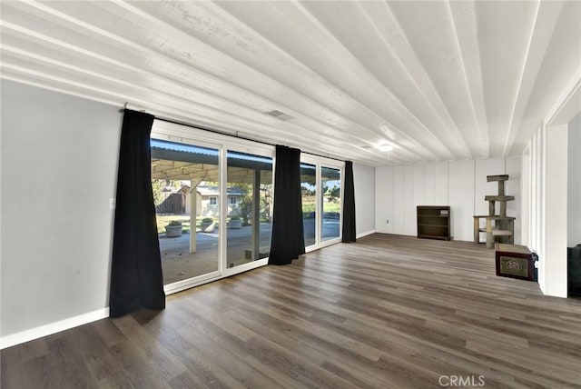 1938 Colusa, Corning, CA 96021 - unfurnished living room featuring dark wood-type flooring and baseboards