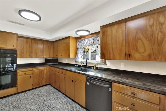 kitchen with dishwasher, sink, and double oven