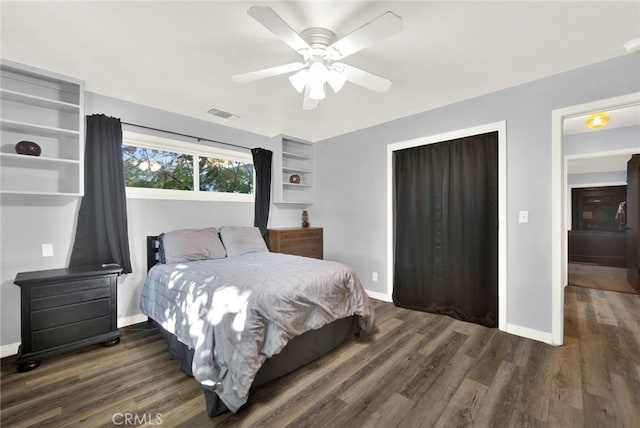 bedroom with ceiling fan and dark hardwood / wood-style floors