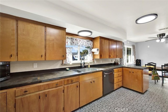 1938 Colusa, Corning, CA 96021 - kitchen with stainless steel dishwasher, black microwave, a ceiling fan, dark countertops, and a peninsula