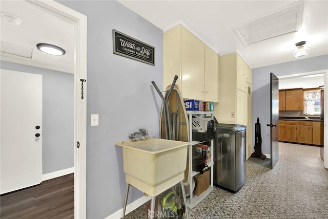 kitchen featuring cream cabinetry, dark hardwood / wood-style flooring, and independent washer and dryer