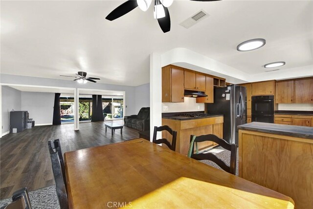 1938 Colusa, Corning, CA 96021 - dining area with a ceiling fan and dark wood-style flooring