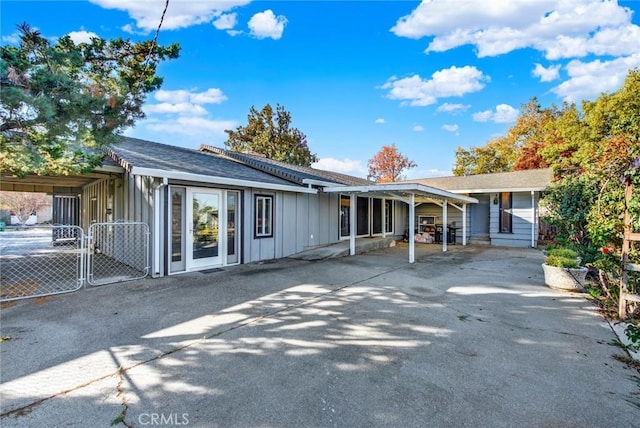 1938 Colusa, Corning, CA 96021 - view of front facade with board and batten siding, a gate, and a shingled roof