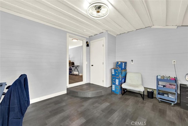 sitting room with dark wood-type flooring