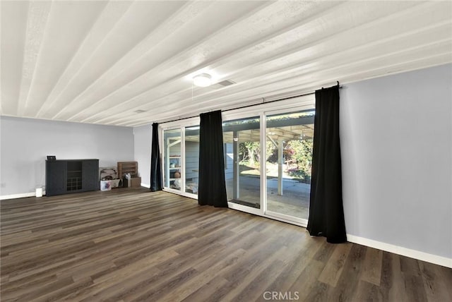 1938 Colusa, Corning, CA 96021 - unfurnished living room featuring baseboards and wood finished floors