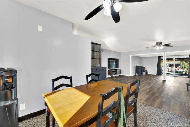 dining space with ceiling fan and hardwood / wood-style floors